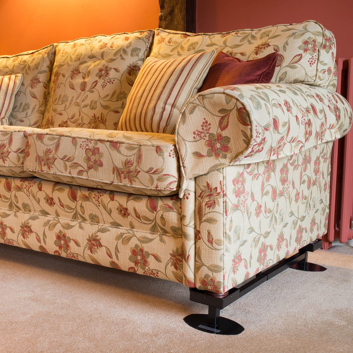 alexander universal furniture raiser with 9cm square cups on settee