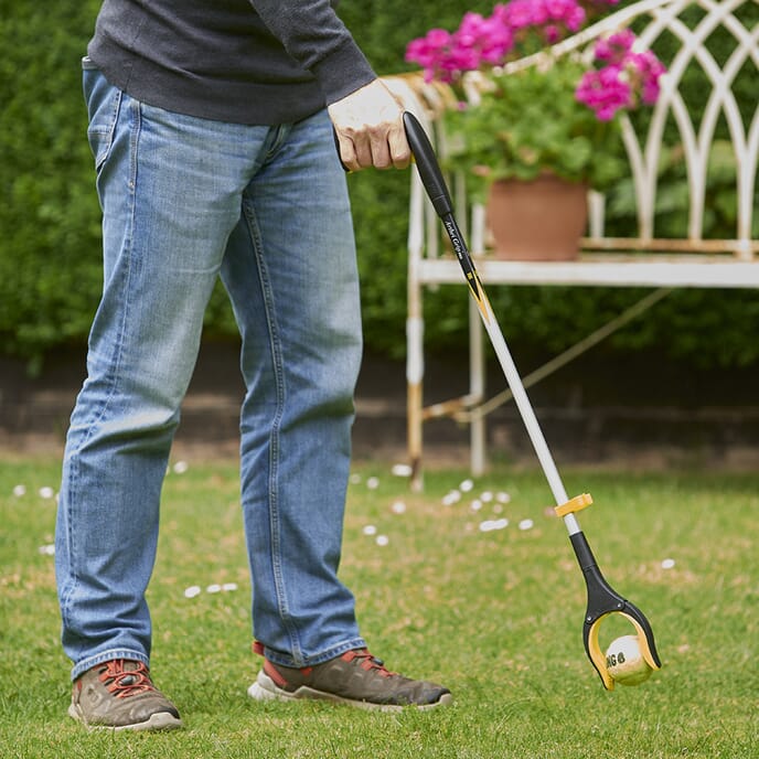 arthri grip pro reacher grabber picking up a ball