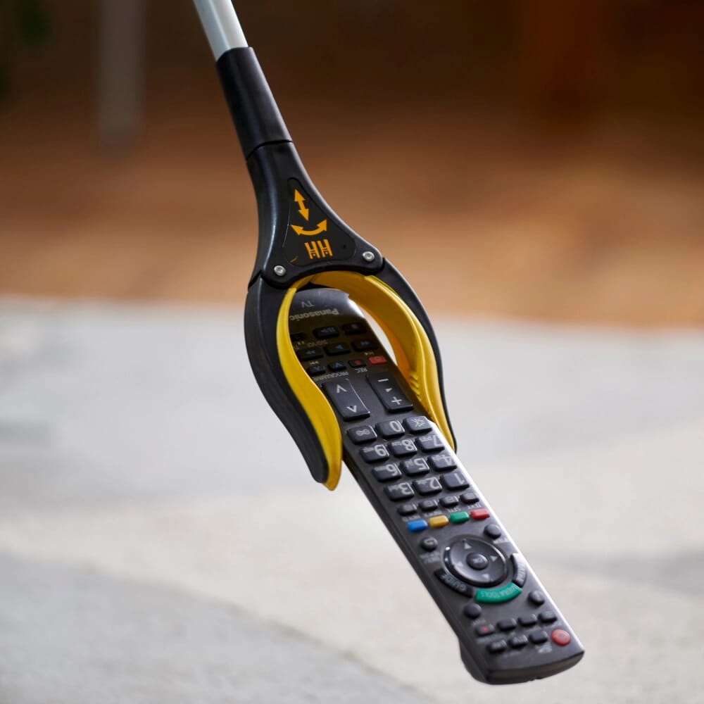 arthri grip pro reacher grabber picking up a remote