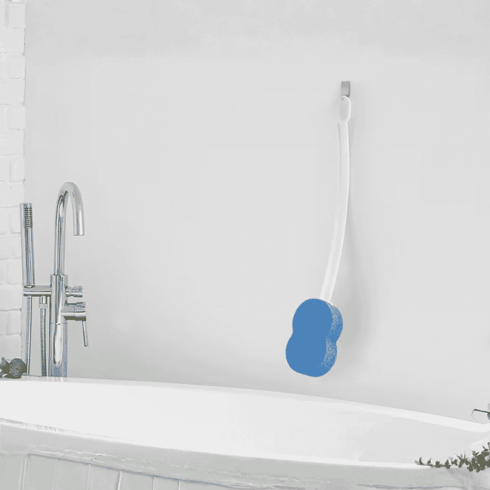bath sponge with long handle next to bath