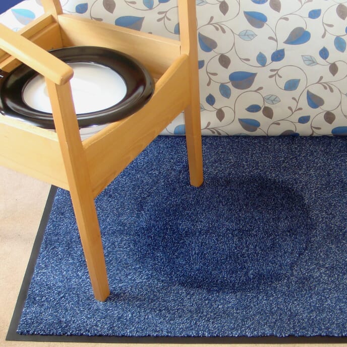 blue wacmat under commode chair