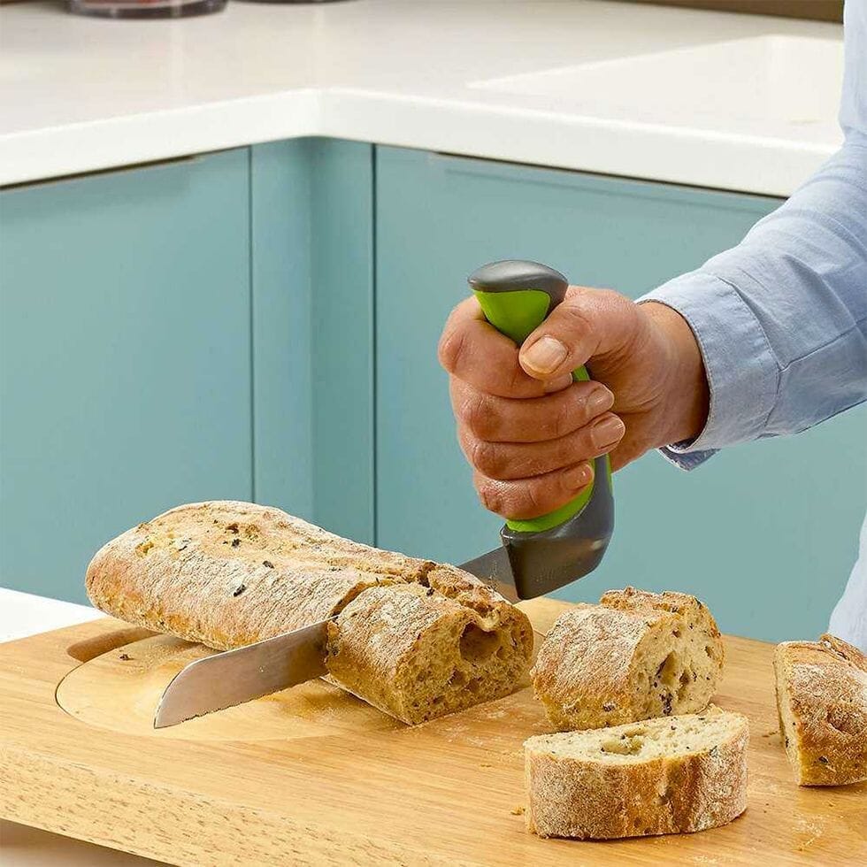 bread knife with angled handle in use