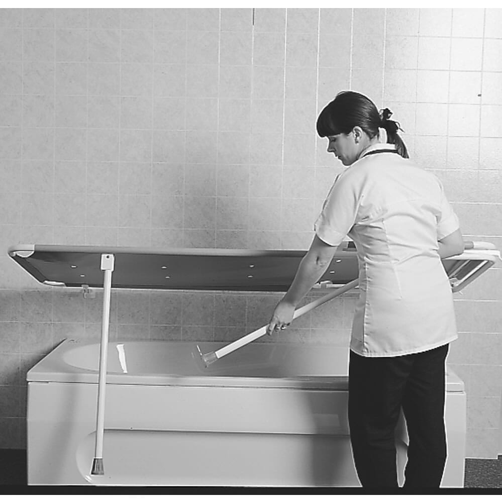 changing shower stretcher being lowered