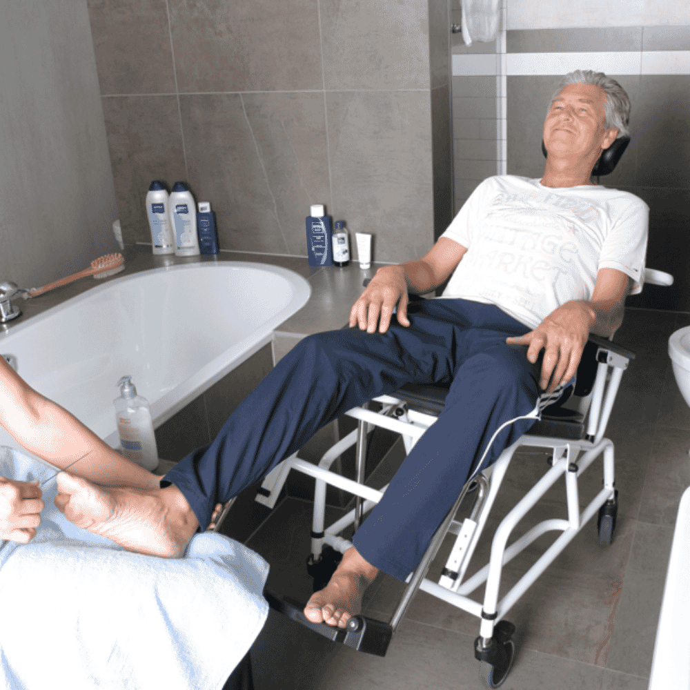 combi tilt in space shower commode chair in use