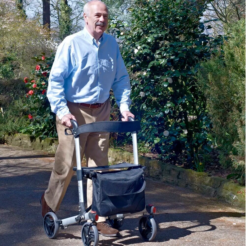 compact adjust rollator silver in use