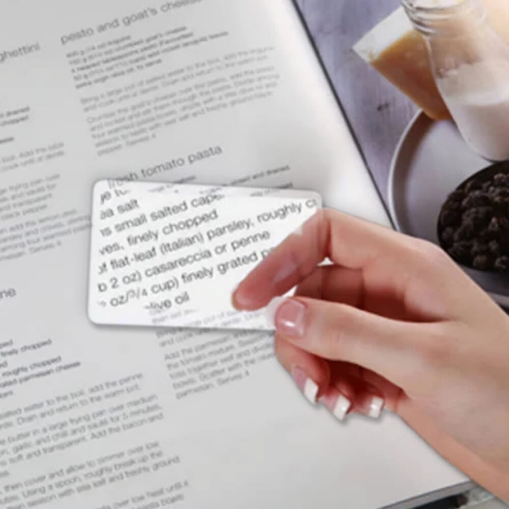 credit card magnifier over book