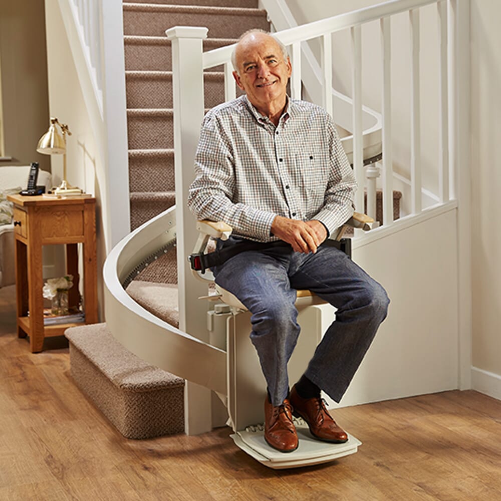 curved stairlift with user