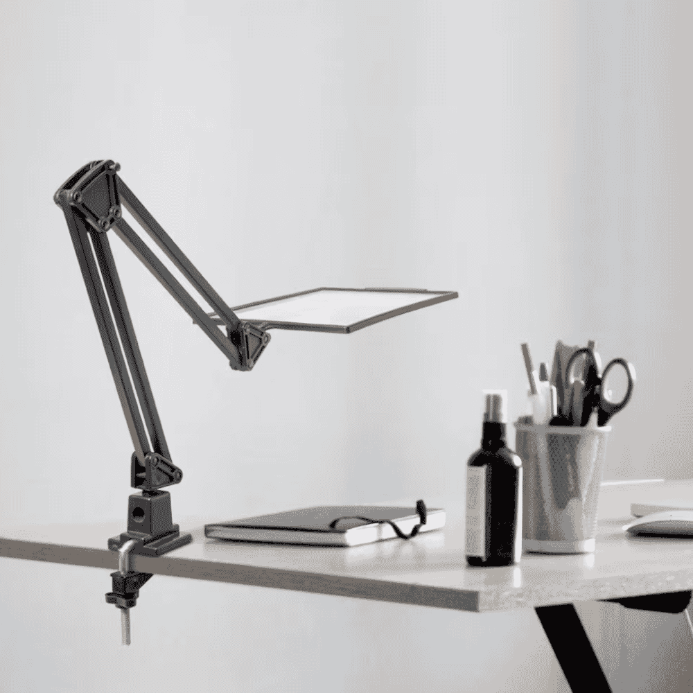 desk top magnifying glass in use