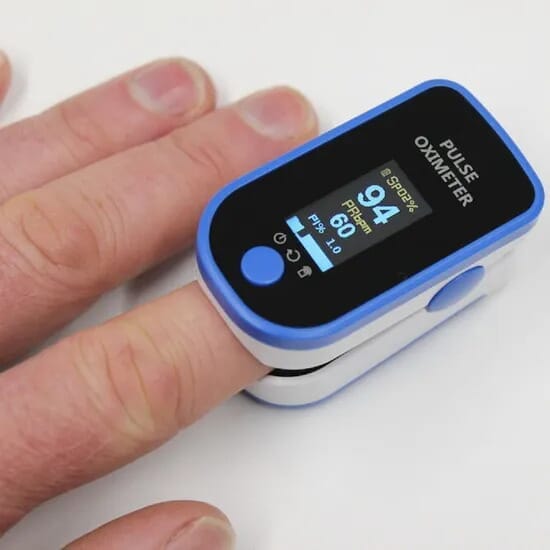 digital fingertip pulse oximeter in use