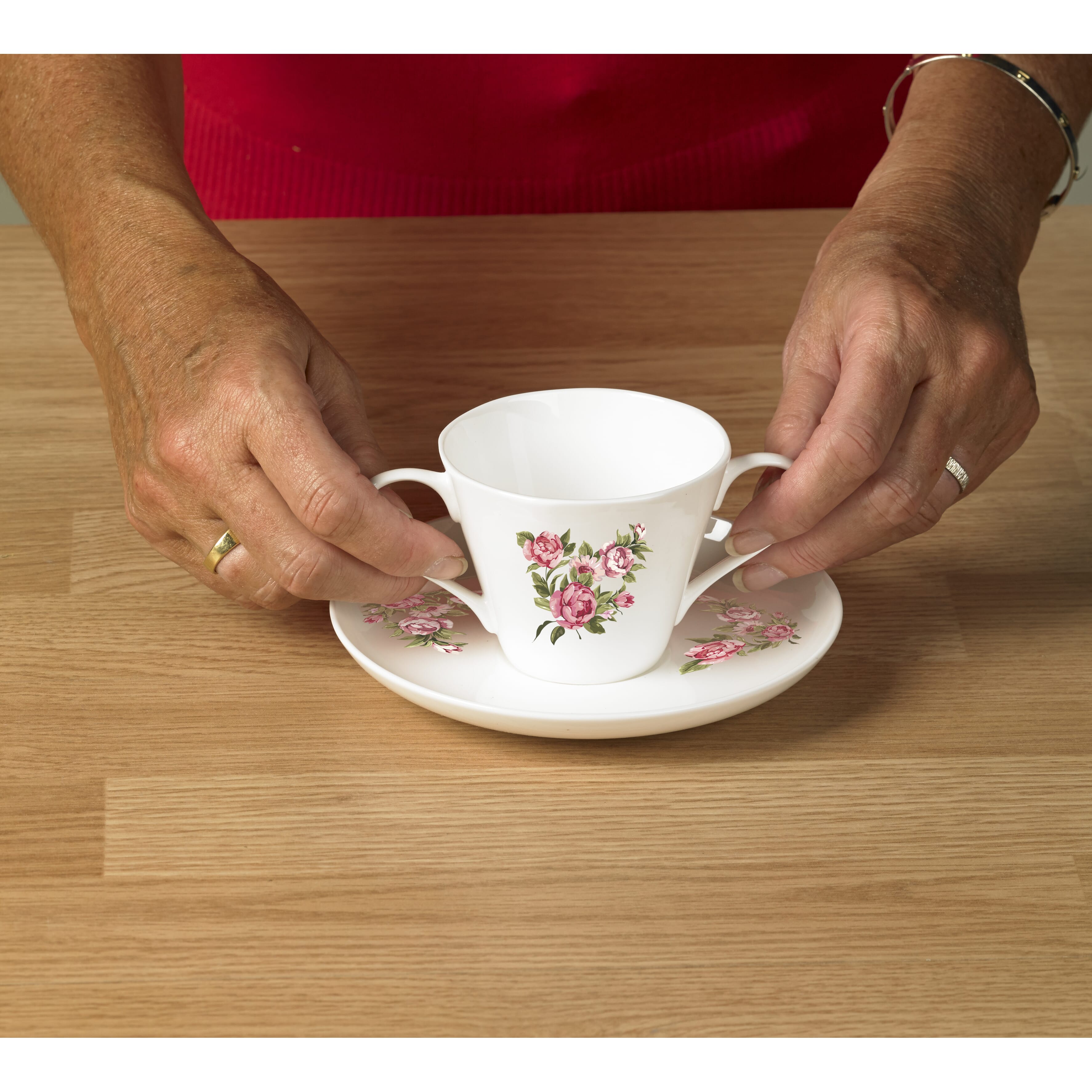 dual handle bone china cup saucer demonstrating handles
