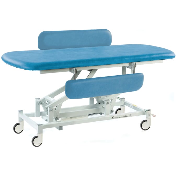 electric therapy hygiene table with central locking wheels and padded side rails canard