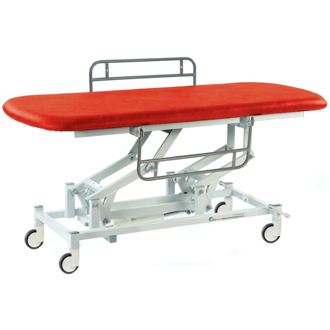 electric therapy hygiene table with central locking wheels and side rails red
