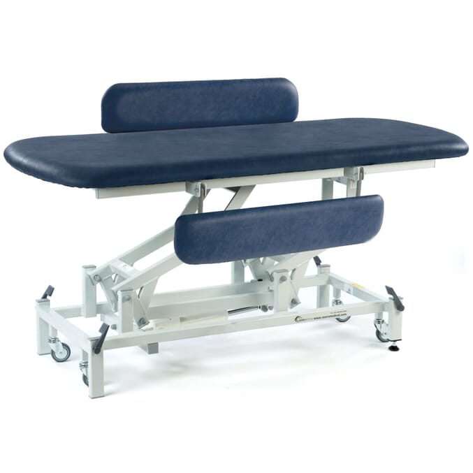 electric therapy hygiene table with retractable wheels and padded side rails dark blue