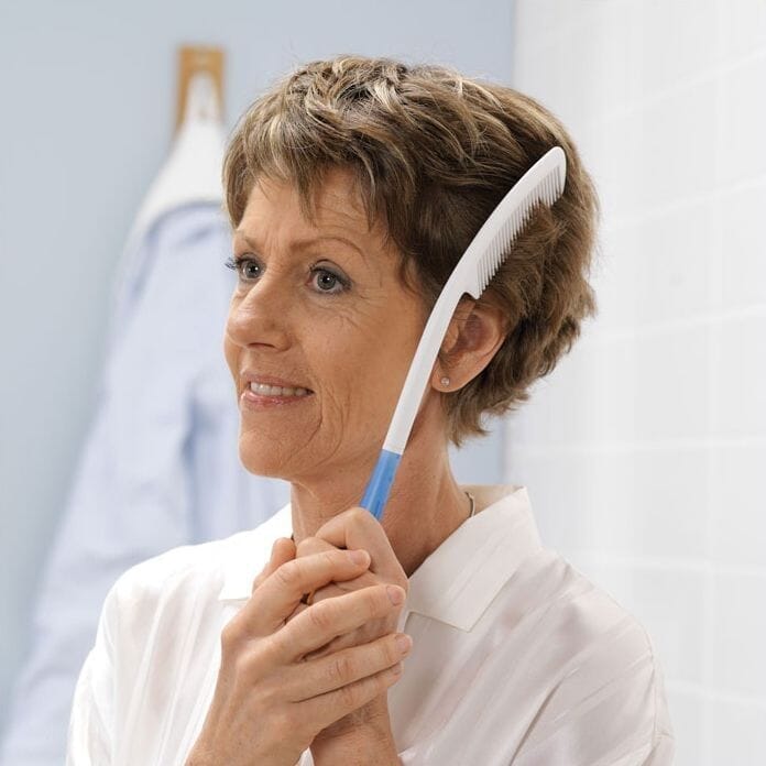 etac beauty long handled comb in use