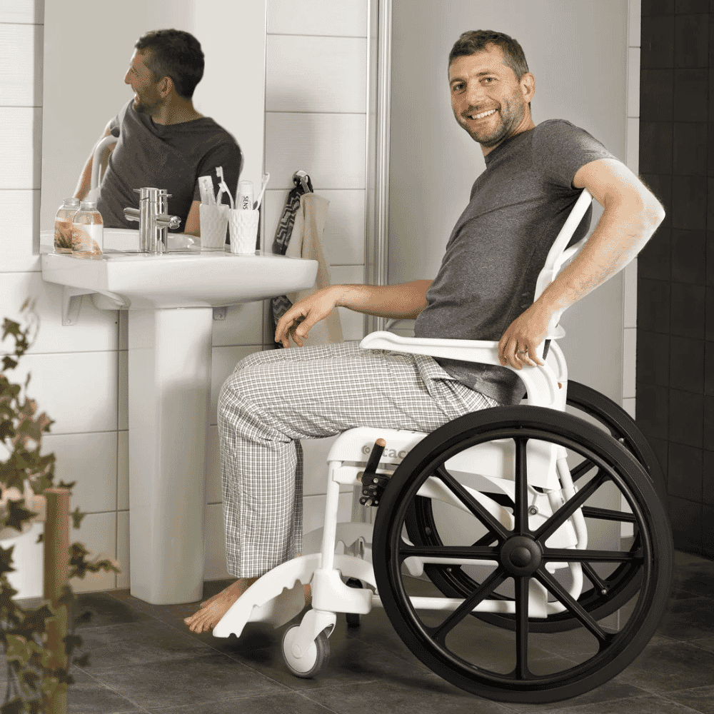 etac clean self propelled shower commode chair in use