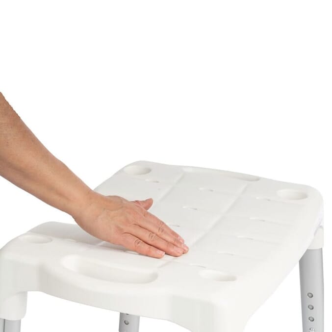 etac swift adjustable shower stool close up