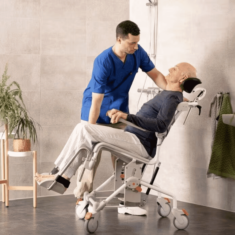etac swift mobile tilt 2 shower commode chair in use