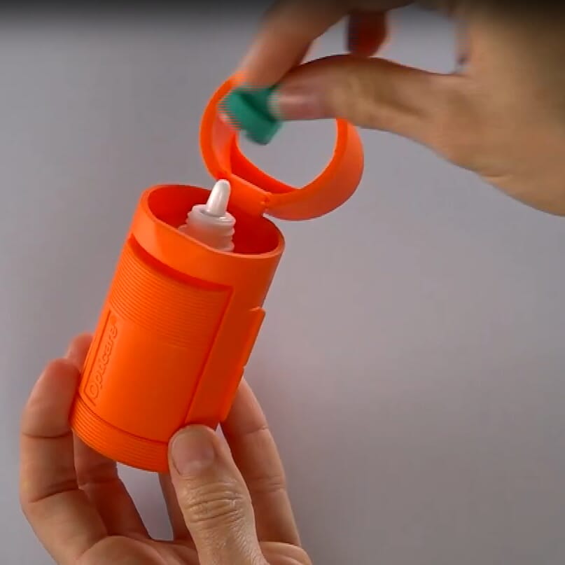 eye drop dispenser showing use of cap
