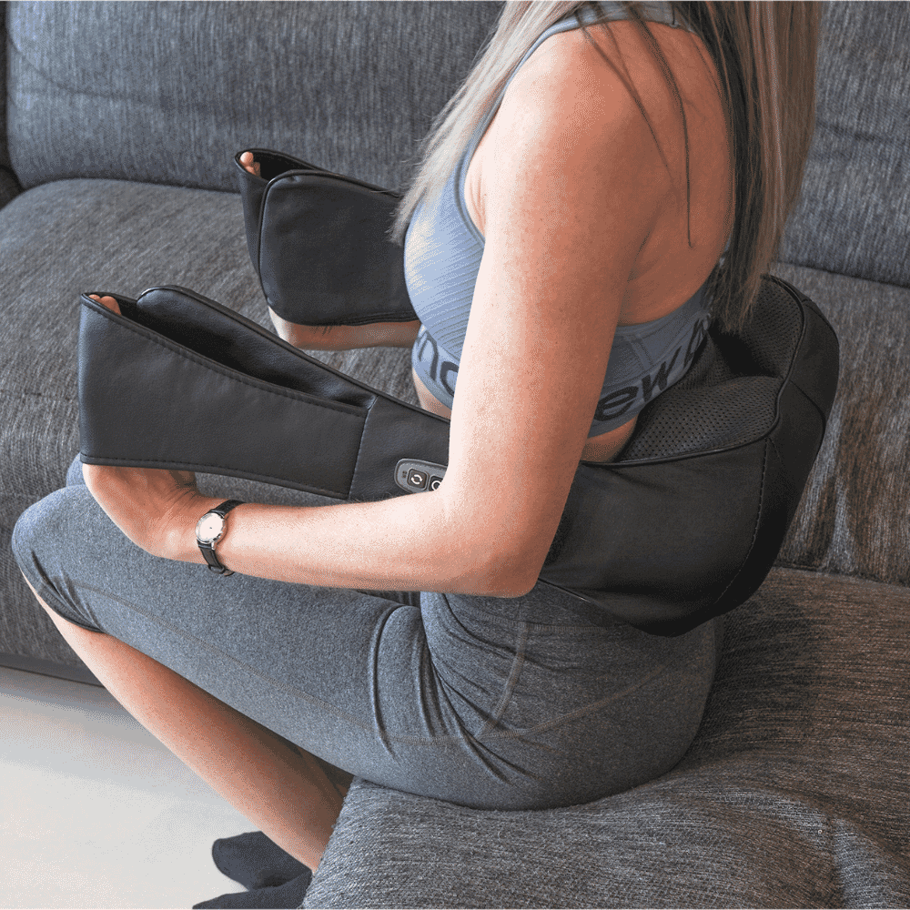 heated neck massager being used on back