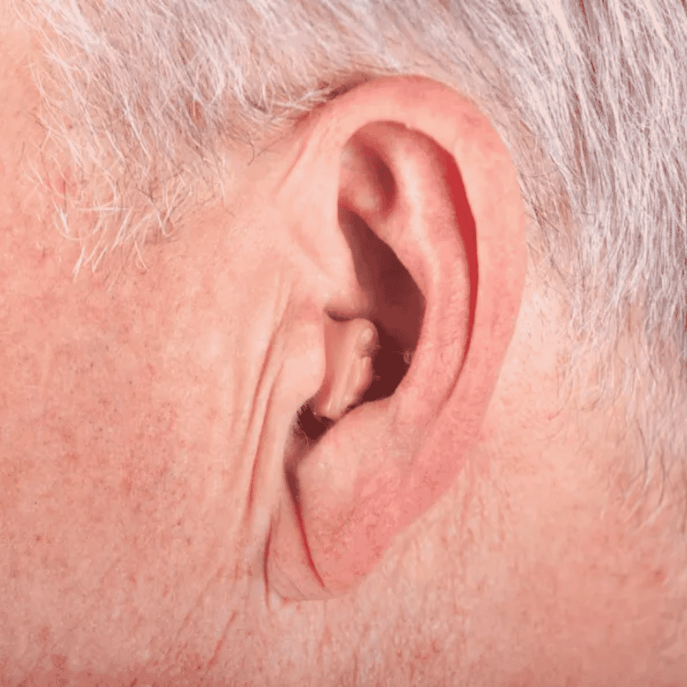 invisible hearing aid in use