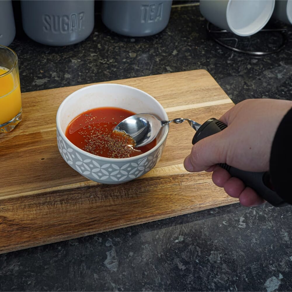large grip bendable spoon in use