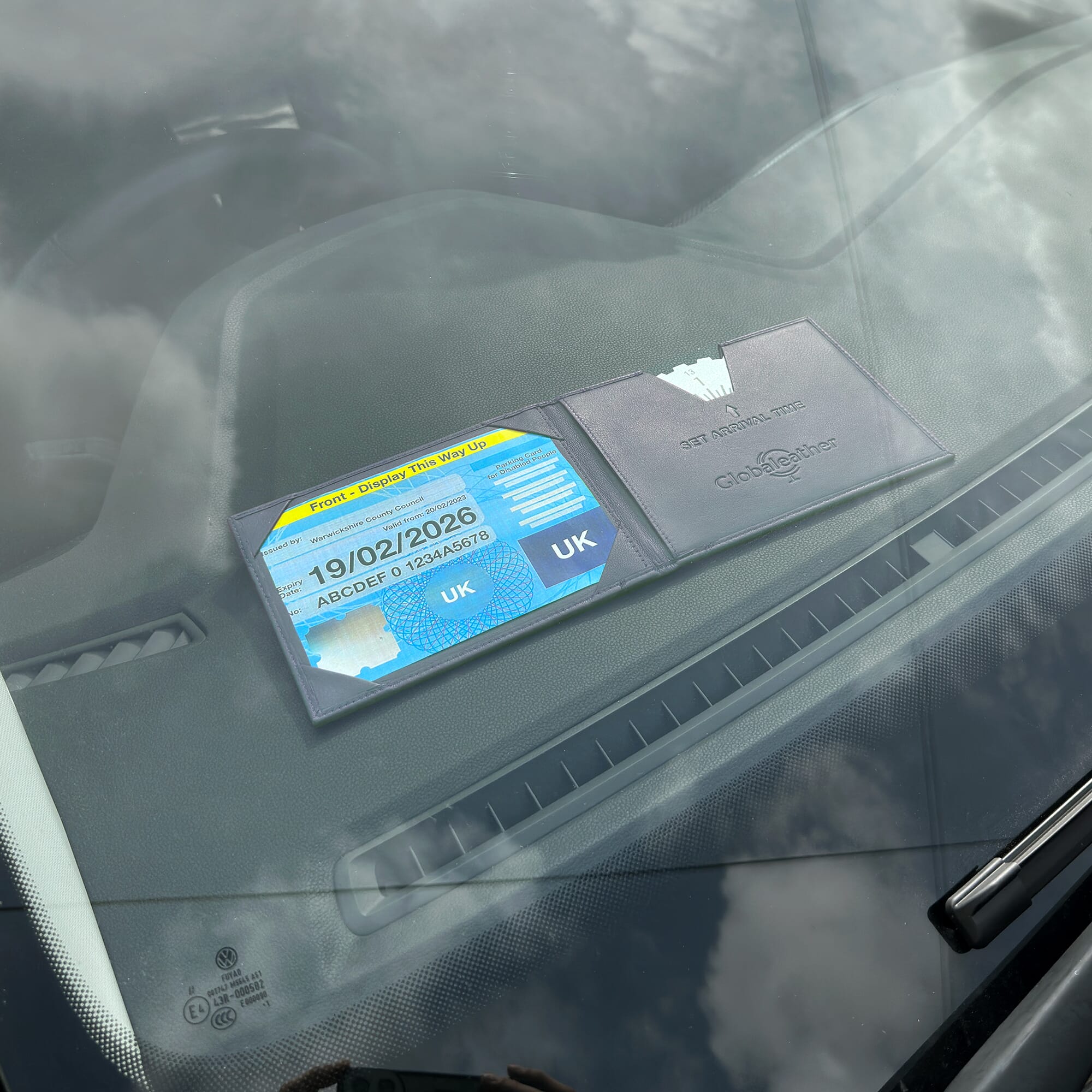 leather blue badge holder in car