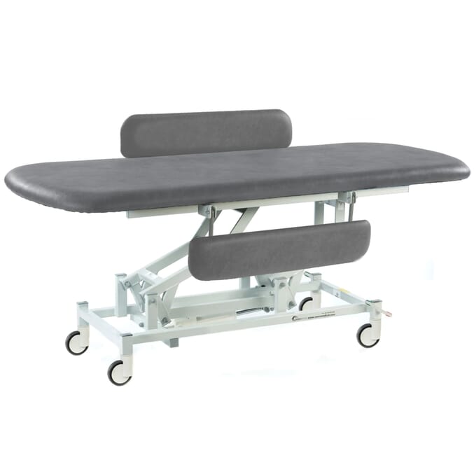 long electric therapy hygiene table with central locking wheels and padded side rails dark grey