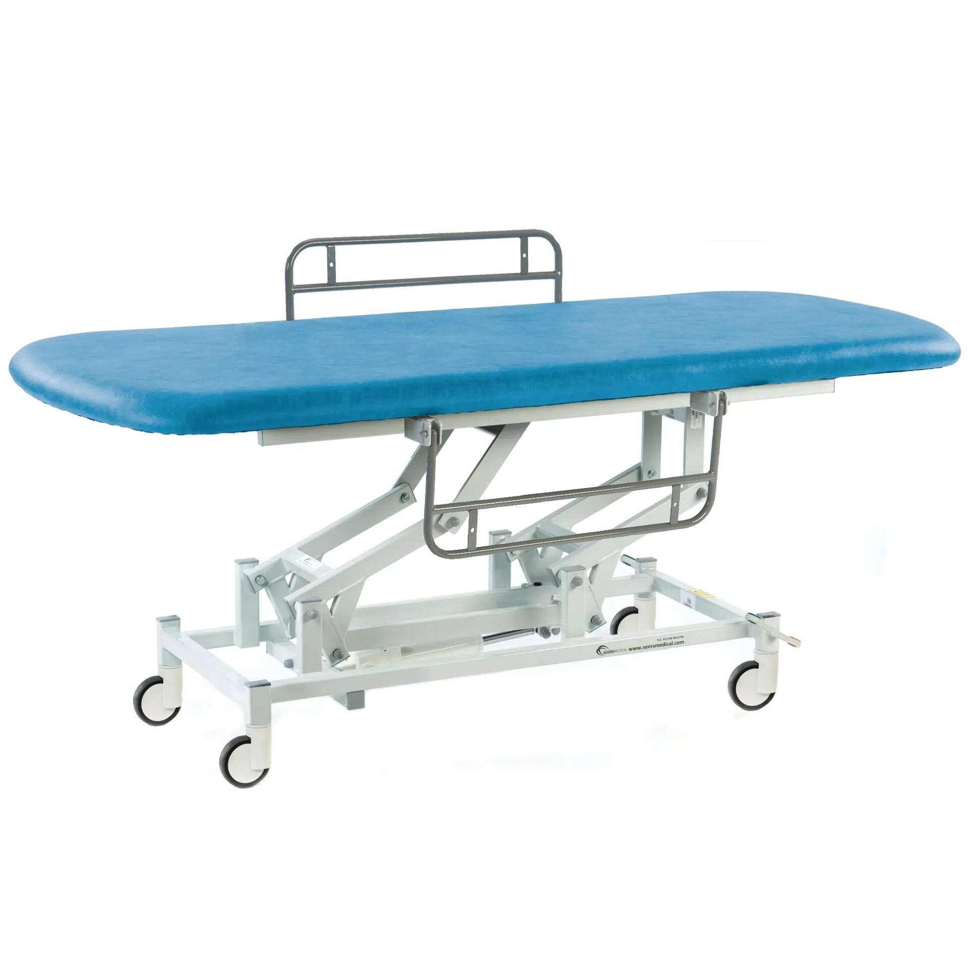 long electric therapy hygiene table with central locking wheels and side rails canard