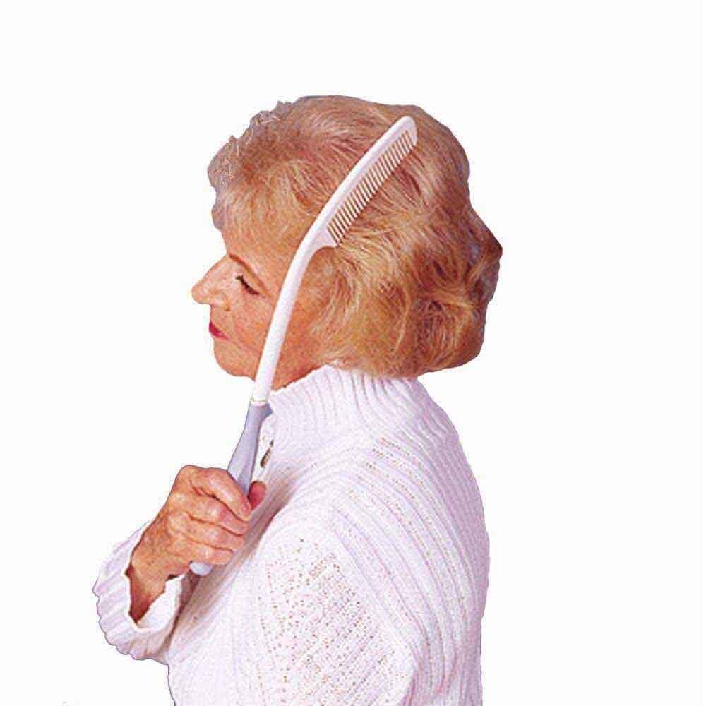 long handled comb in use