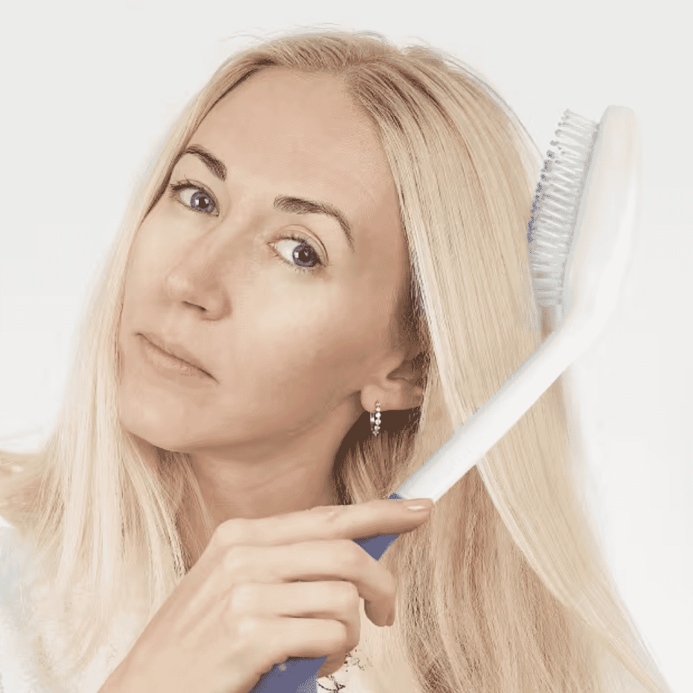 long handled hair brush in use