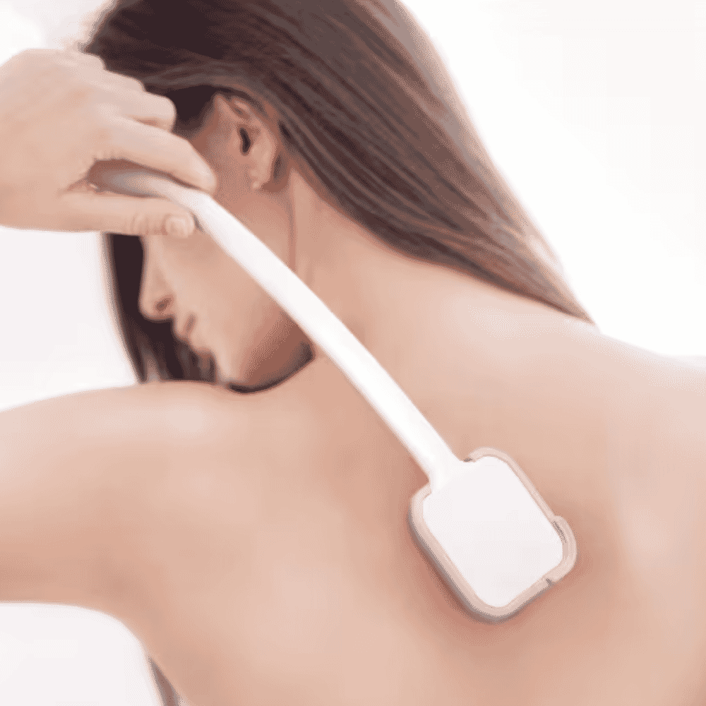 long handled lotion applicator in use