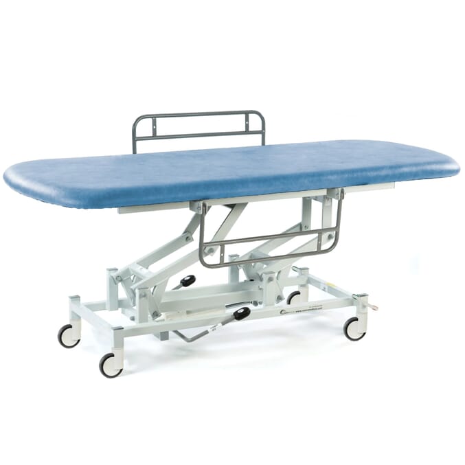 long hydraulic therapy hygiene table with central locking wheels and side rails sky blue