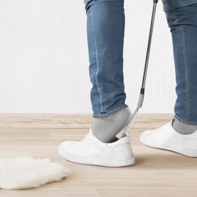 luxury chrome shoe horn in use