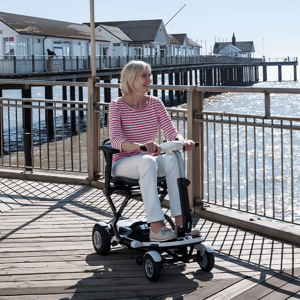 minimo plus folding mobility scooter white in use
