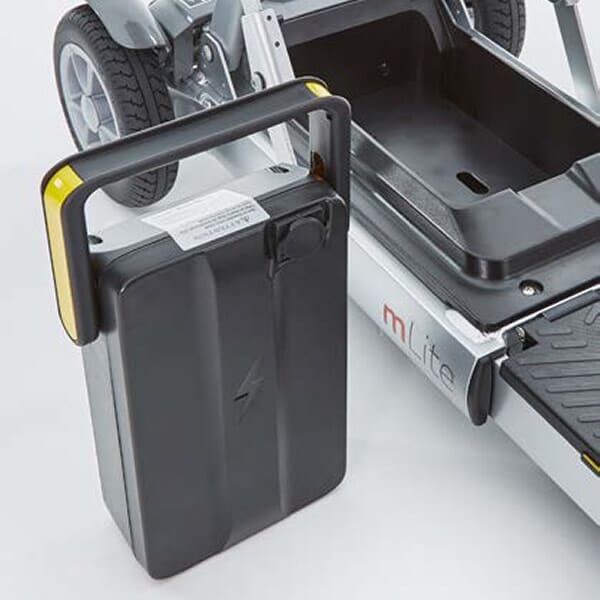 mlite 9 9ah removable battery pack next to scooter