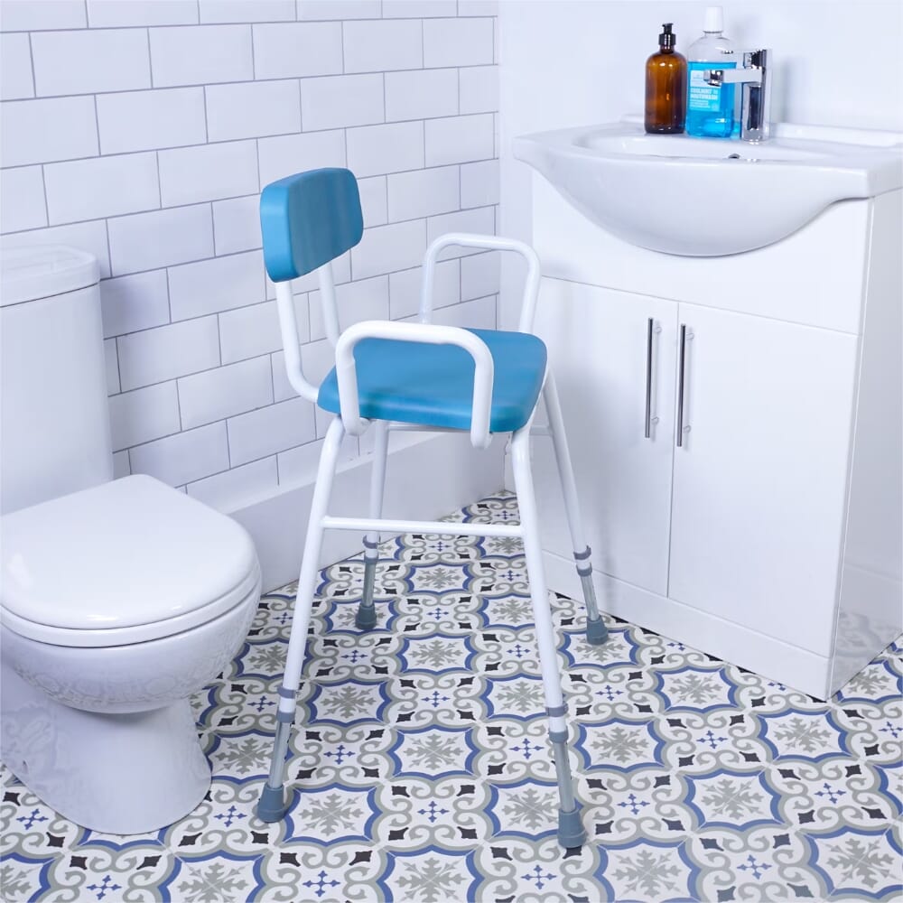 multi use perching stool with padded backrest in bathroom