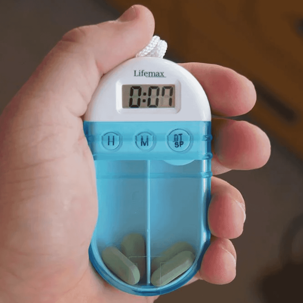 pill box reminder in hand