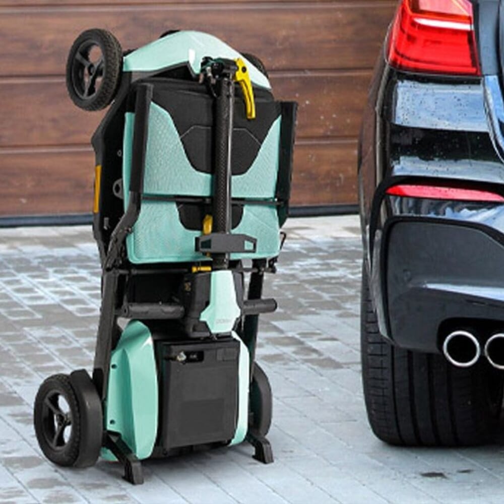 pride gogo super portable folding mobility scooter mint folded next to car