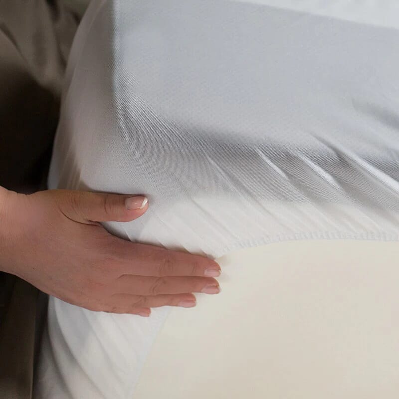 protect a bed mattress protector tucked under mattress