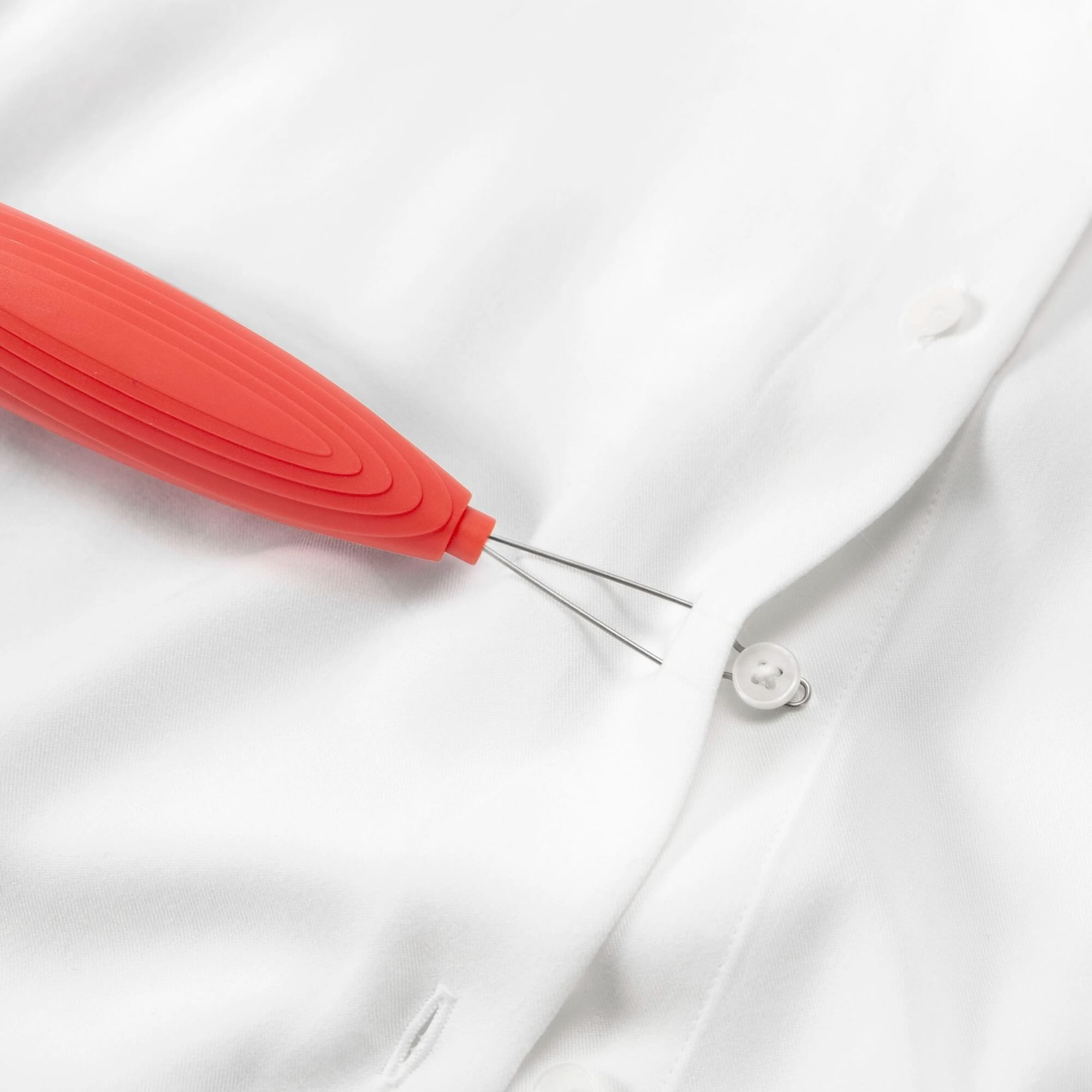 red button hook zip puller showing button use