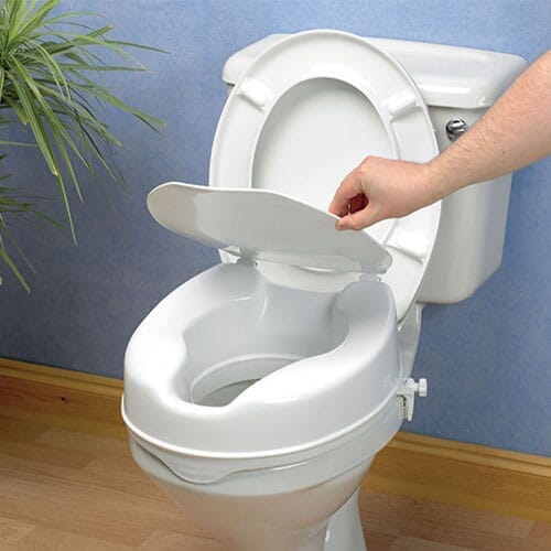savanah raised contoured toilet seat with lid on toilet