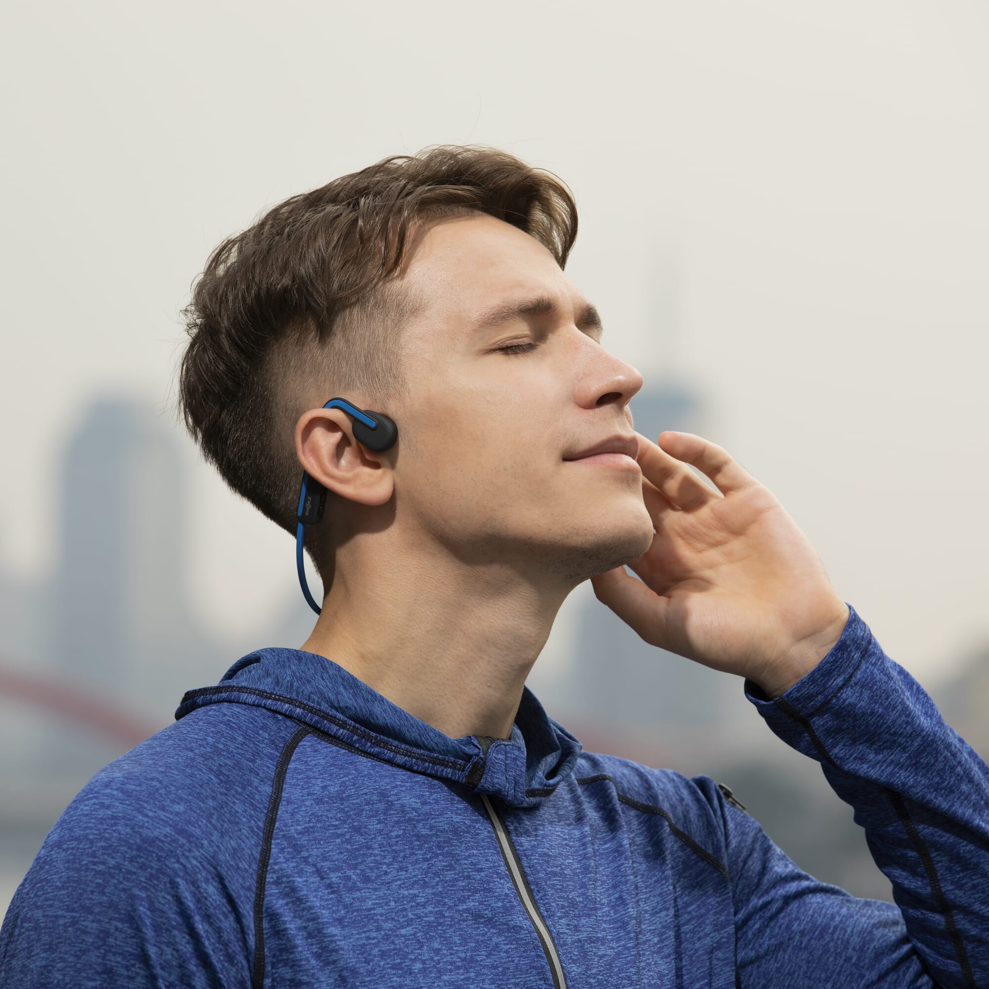 shokz openmove headphones in use