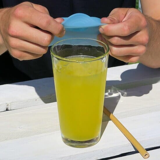 silicone cup cover going over a glass