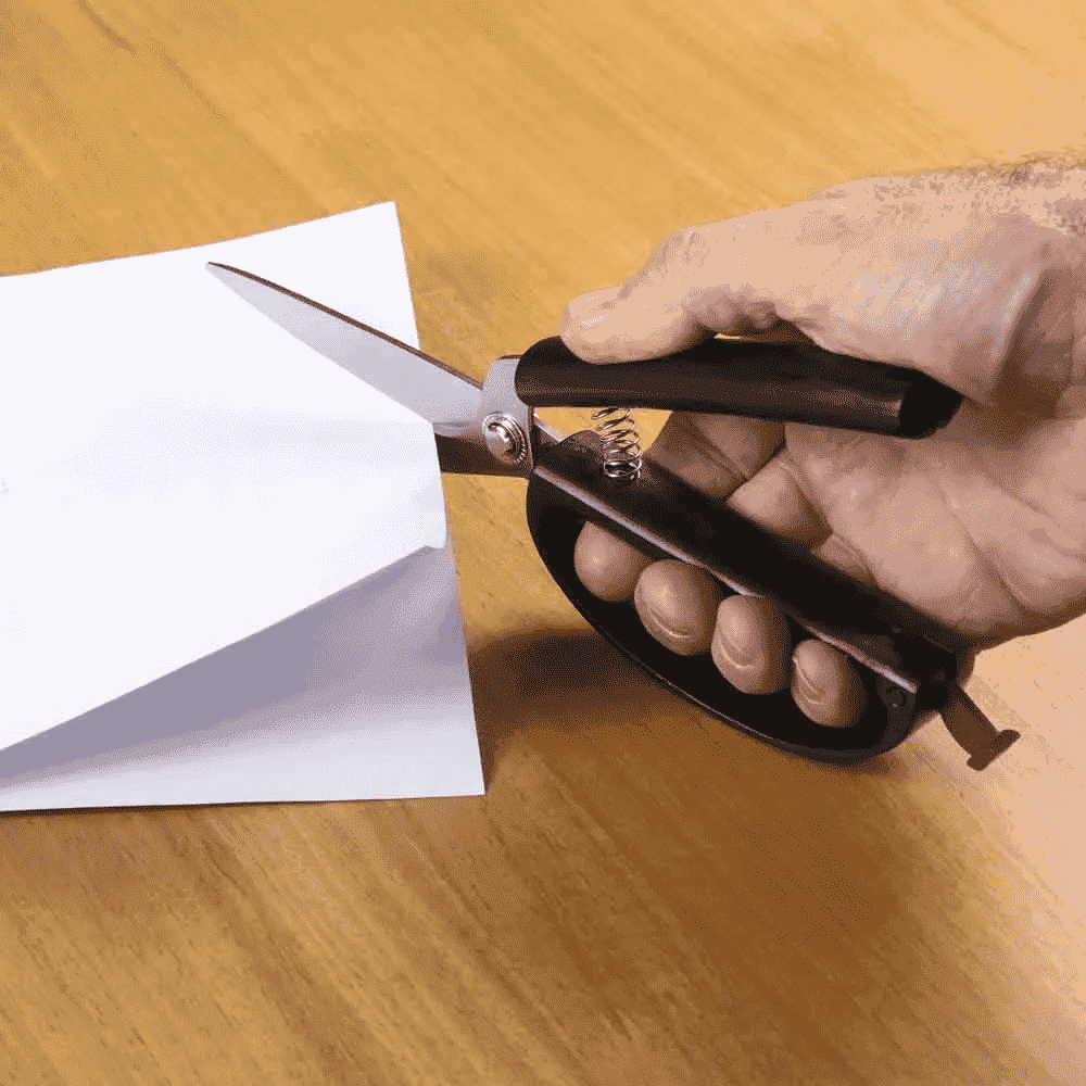 spring self opening scissors in use