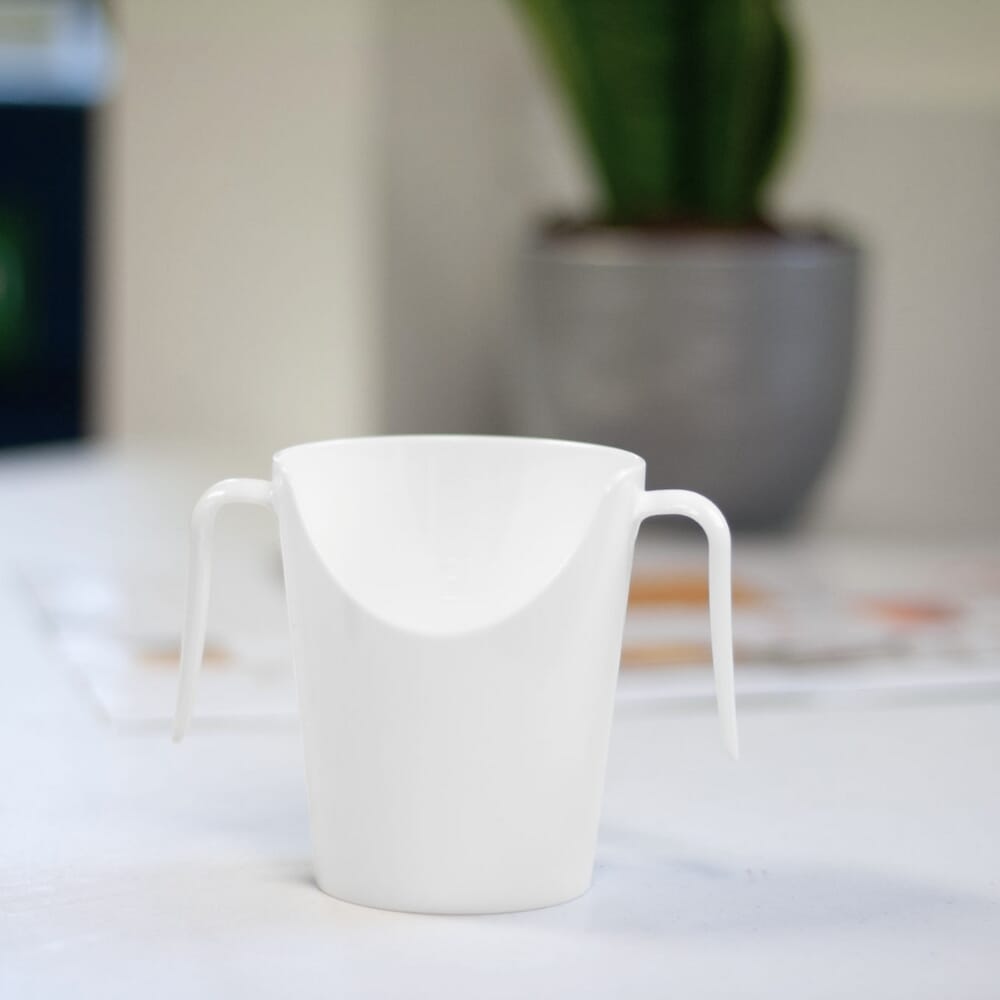 two handled nose cup white on table