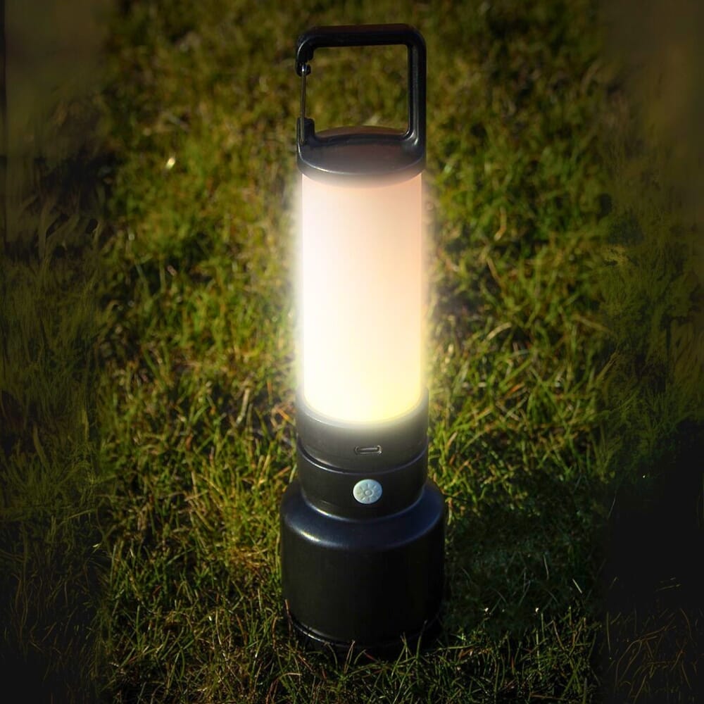 uni com rechargeable torch and lantern on grass