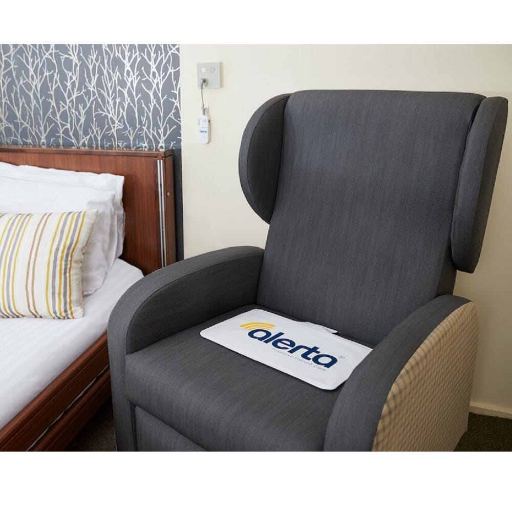 wireless chair alert mat and transmitter alarm in a room setting